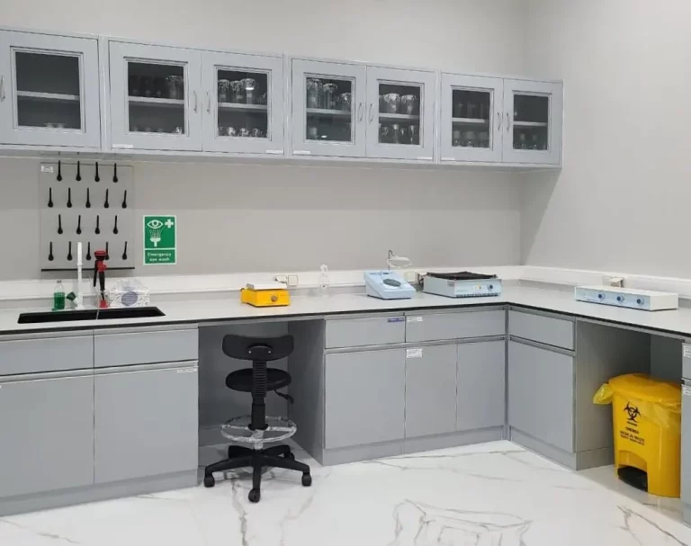 Modern food safety and microbiology laboratory at PT Neogene Vizion Indonesia, featuring professional workstations and diagnostic equipment.